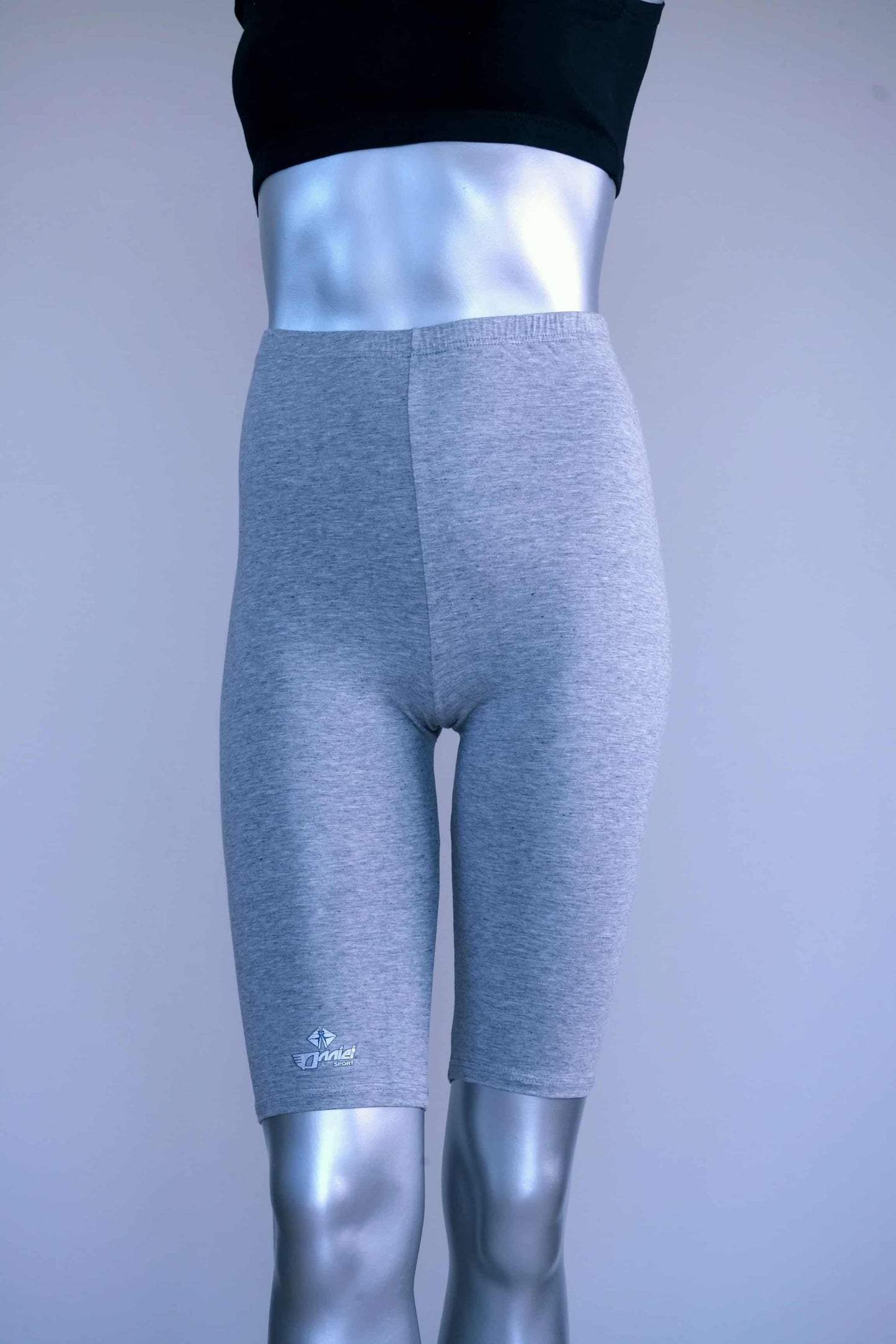 Front view of vintage above the knee grey biker shorts on a silver mannequin.