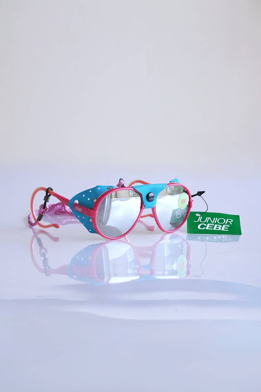 Pink and blue CÉBÉ Baby Glacier Sunglasses on white background