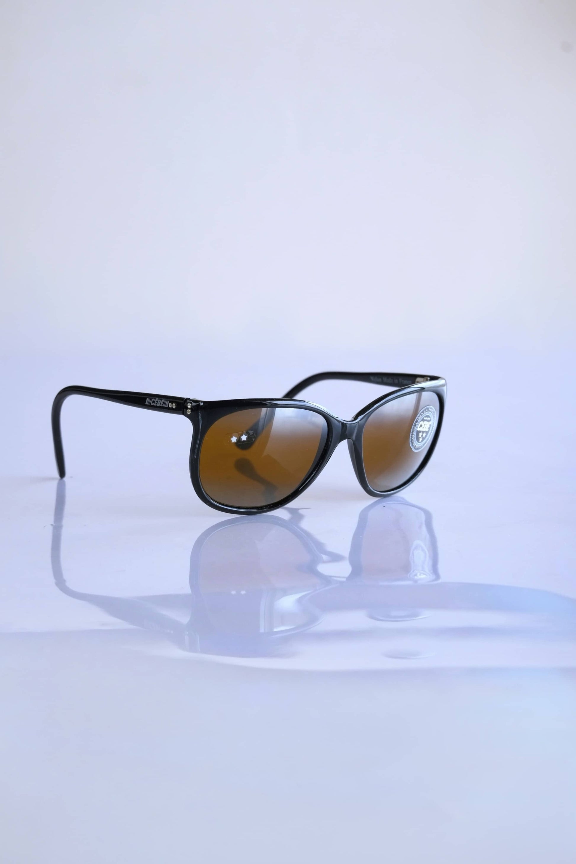 CÉBÉ 90's Classic Mirrored Lens Sunglasses in black on white background