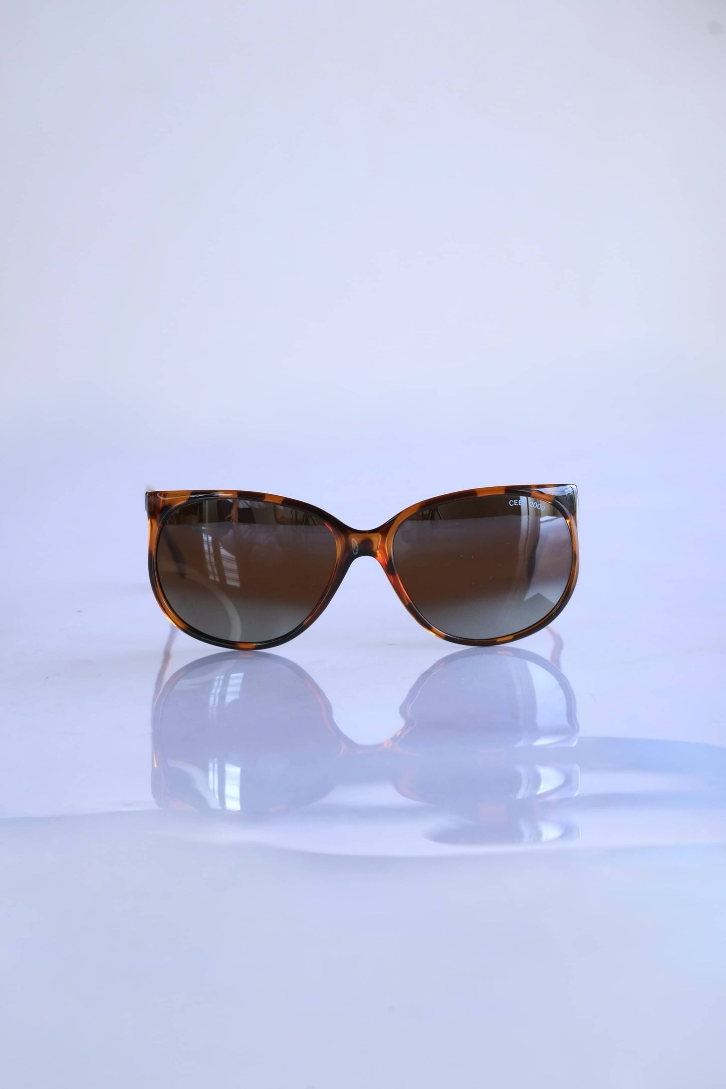 CÉBÉ 90's Classic Mirrored Lens Sunglasses in tortoise on white background