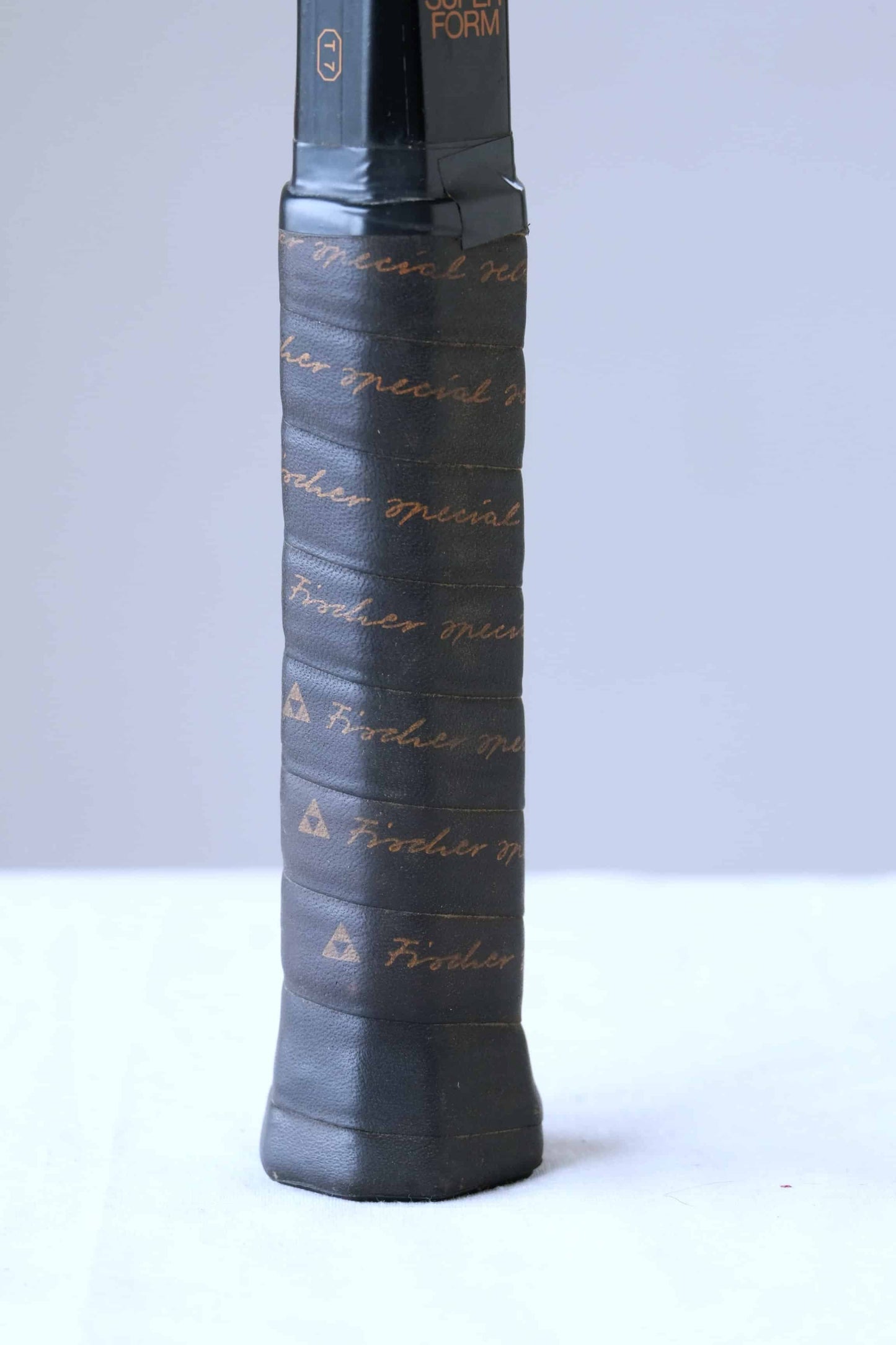 Close view of the handle of FISCHER Superform Vintage Tennis Racquet