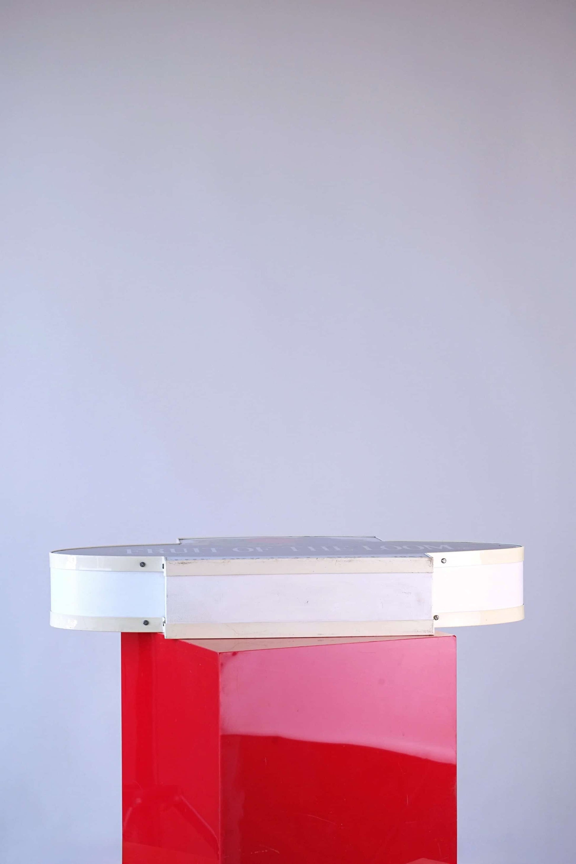Bottom view of 1990s Fruit of the Loom light-up display sign showing white metal frame and mounting edges.