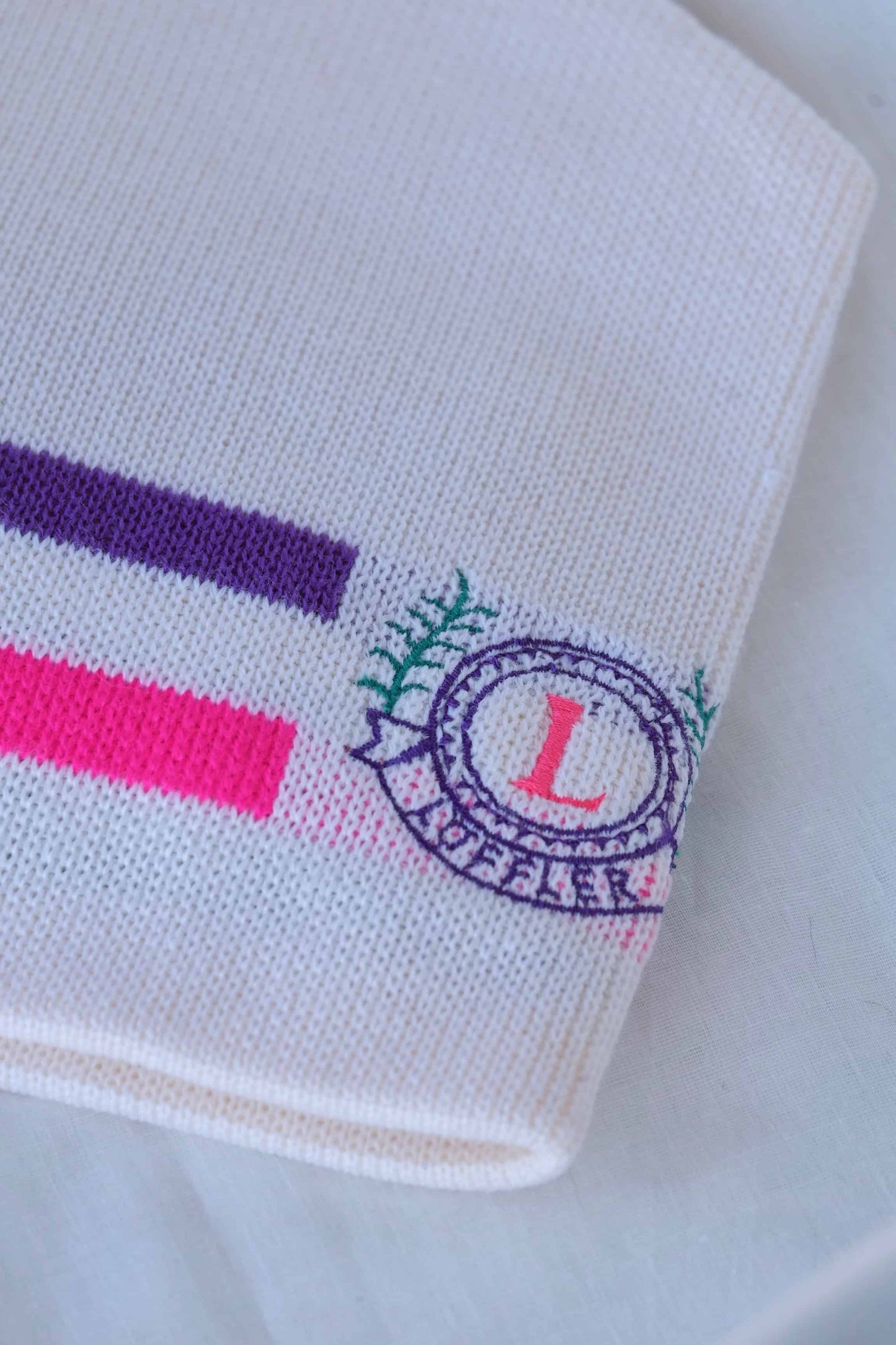 LÖFFLER Retro Snow Beanie white with neon pink and purple lines details