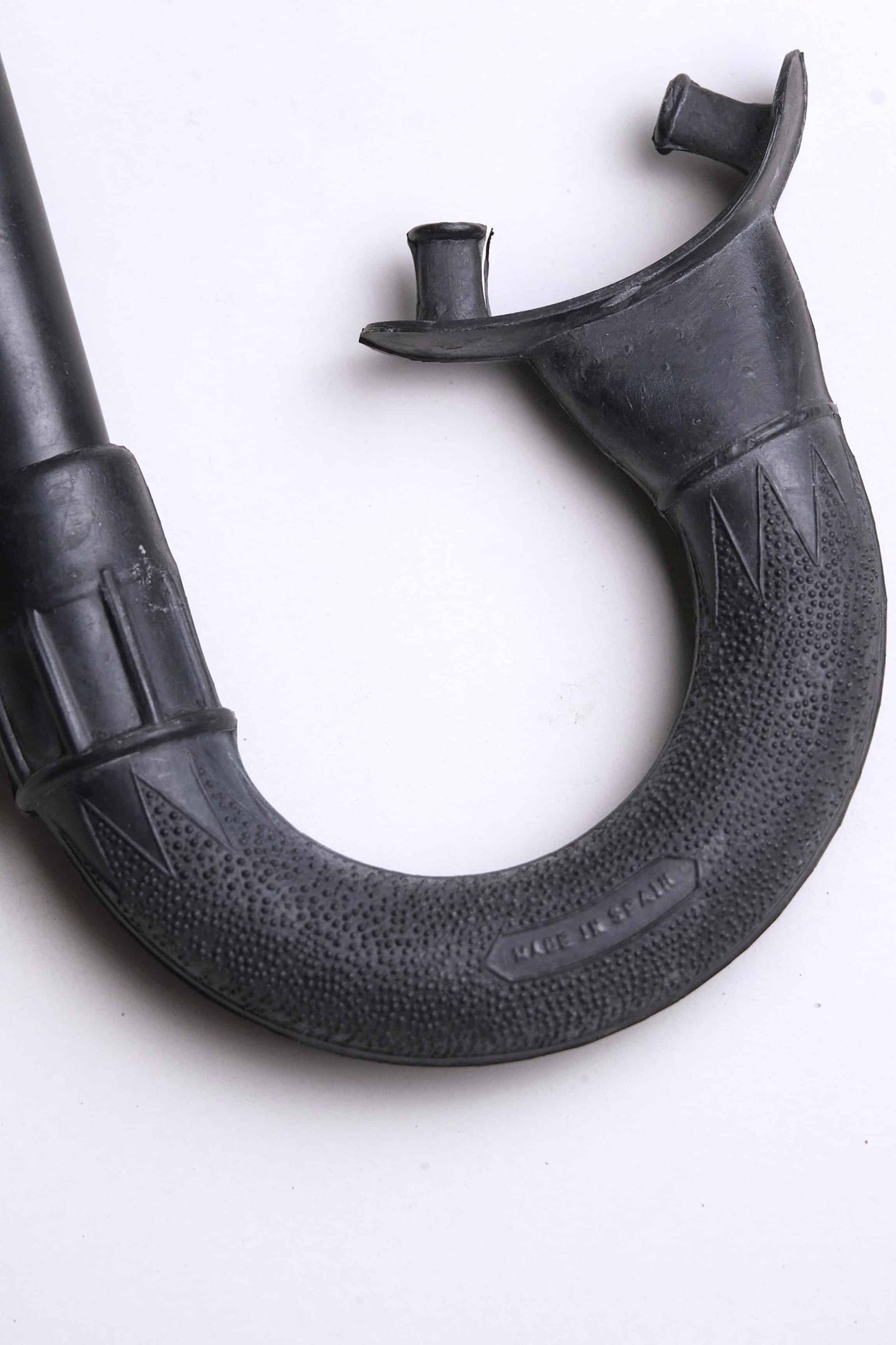 Close up of the mouthpiece of a Vintage Nemrod Menorca snorkel on white background