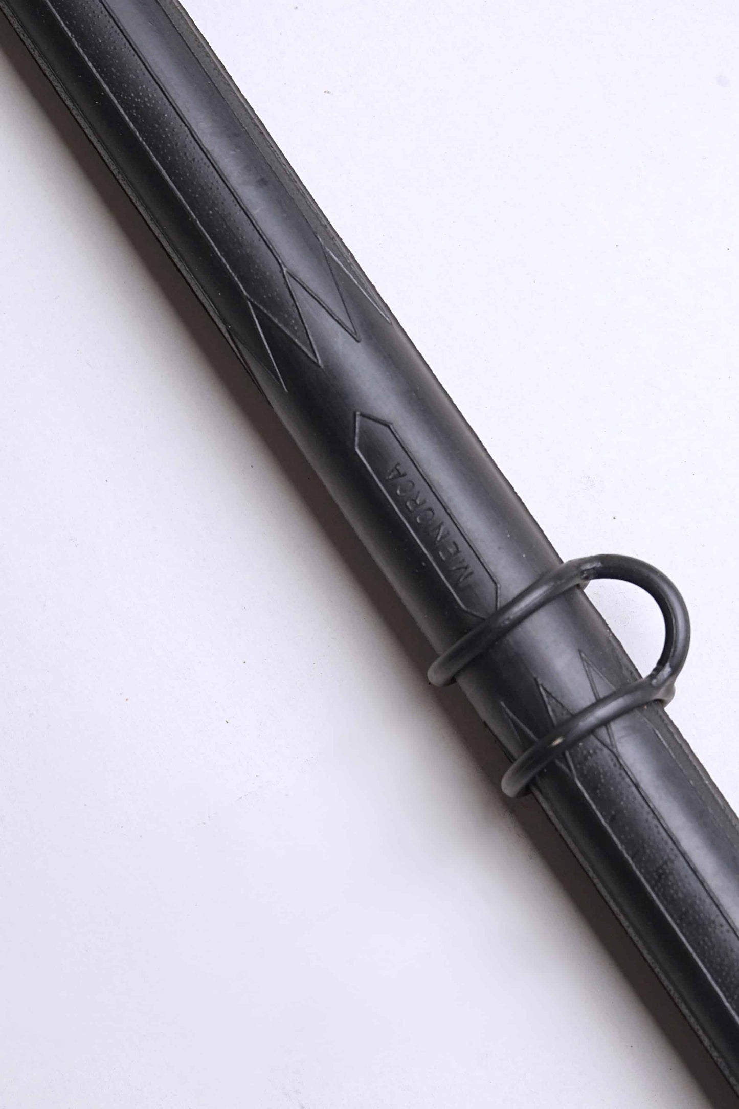 Close up of a Vintage Nemrod Menorca snorkel on white background, showing the word Menorca.