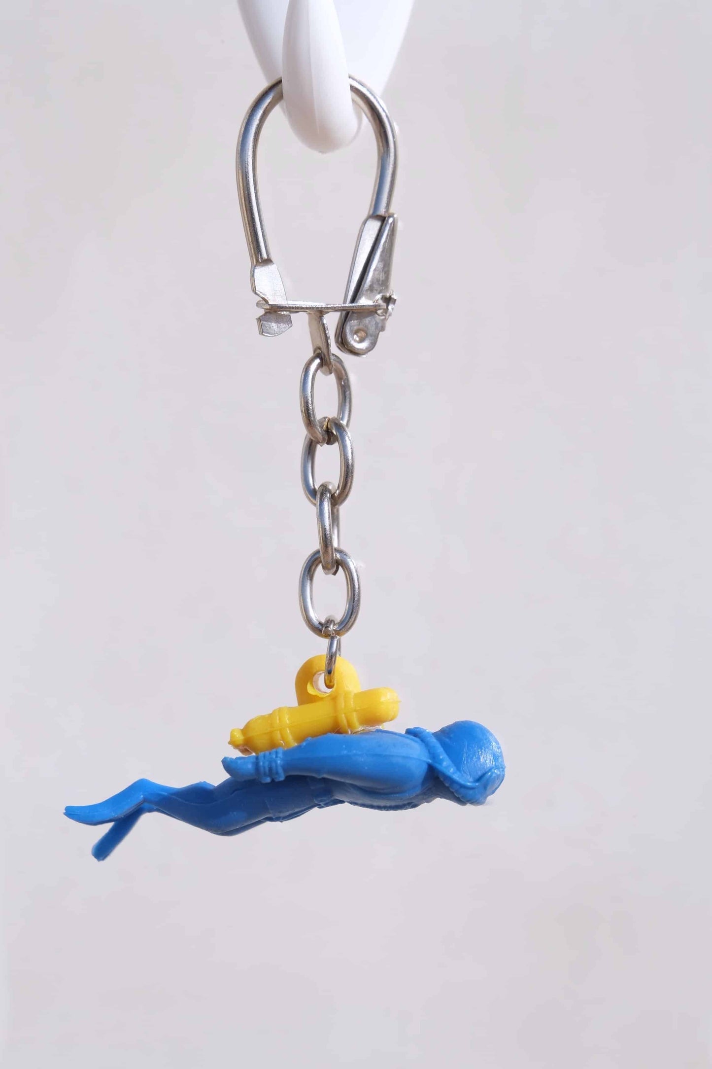 Nemrod diver keychain photographed on a white background.