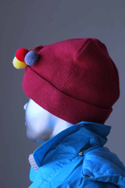 POM-POM Beanie dark red with 4 colorful pom-poms on mannequin