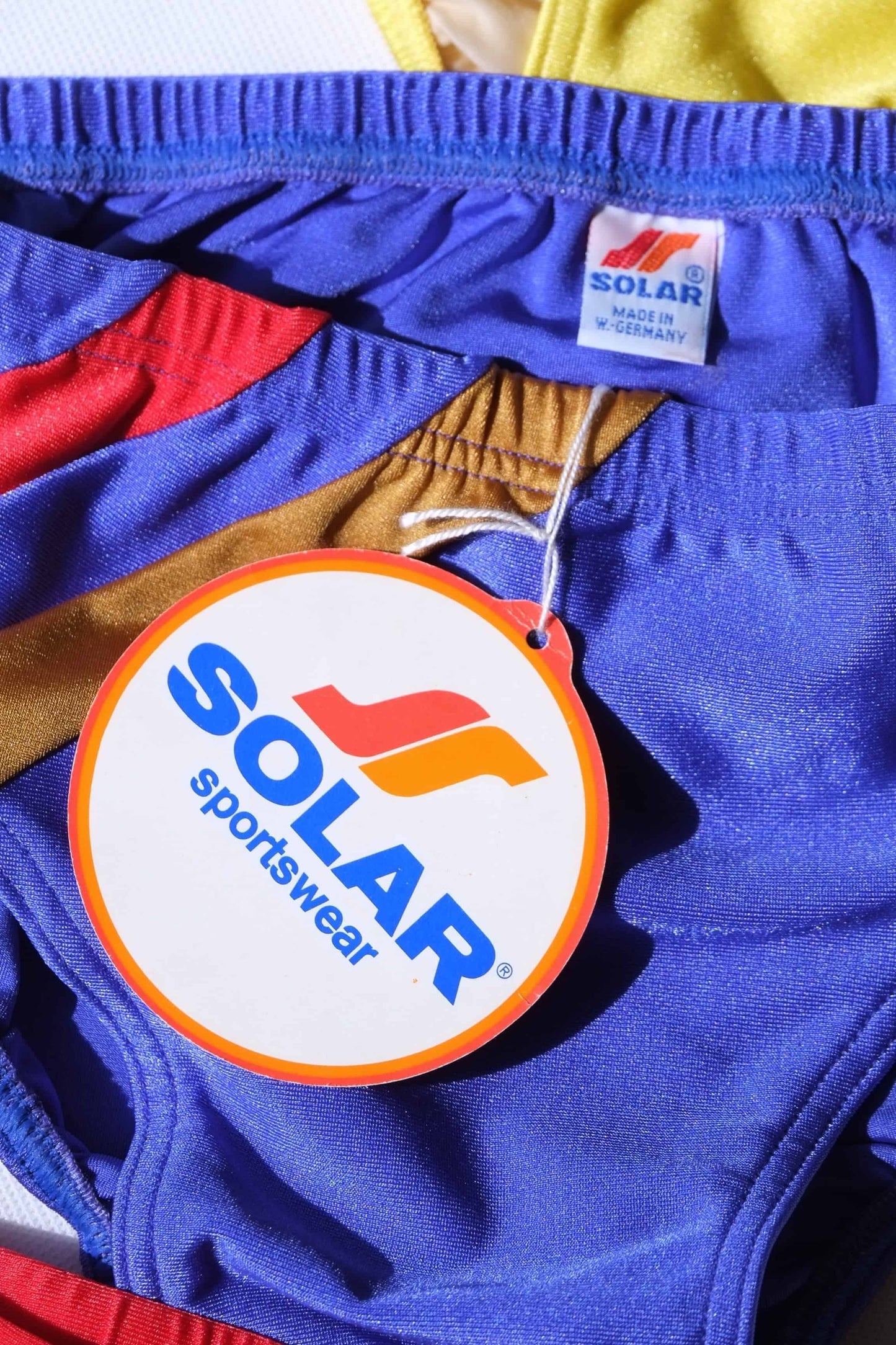 Close-up of blue swim briefs with Solar sportswear tag