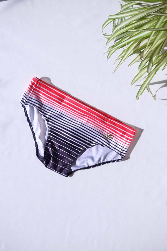 A single pair of SOLAR brand vintage 80s men's swim briefs featuring a red-to-black gradient horizontal stripe pattern.