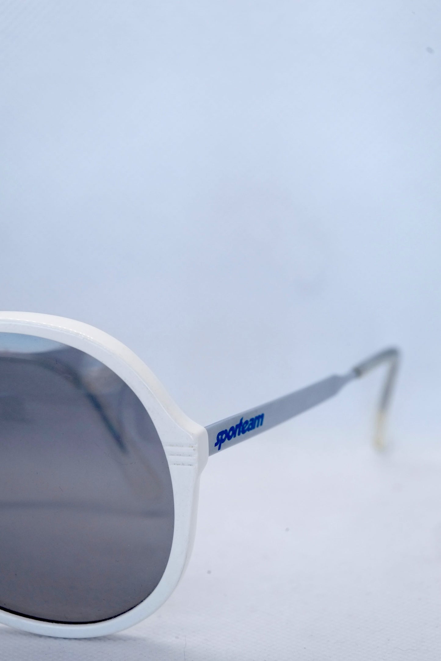 Detail view of white sporteam vintage frames on white background