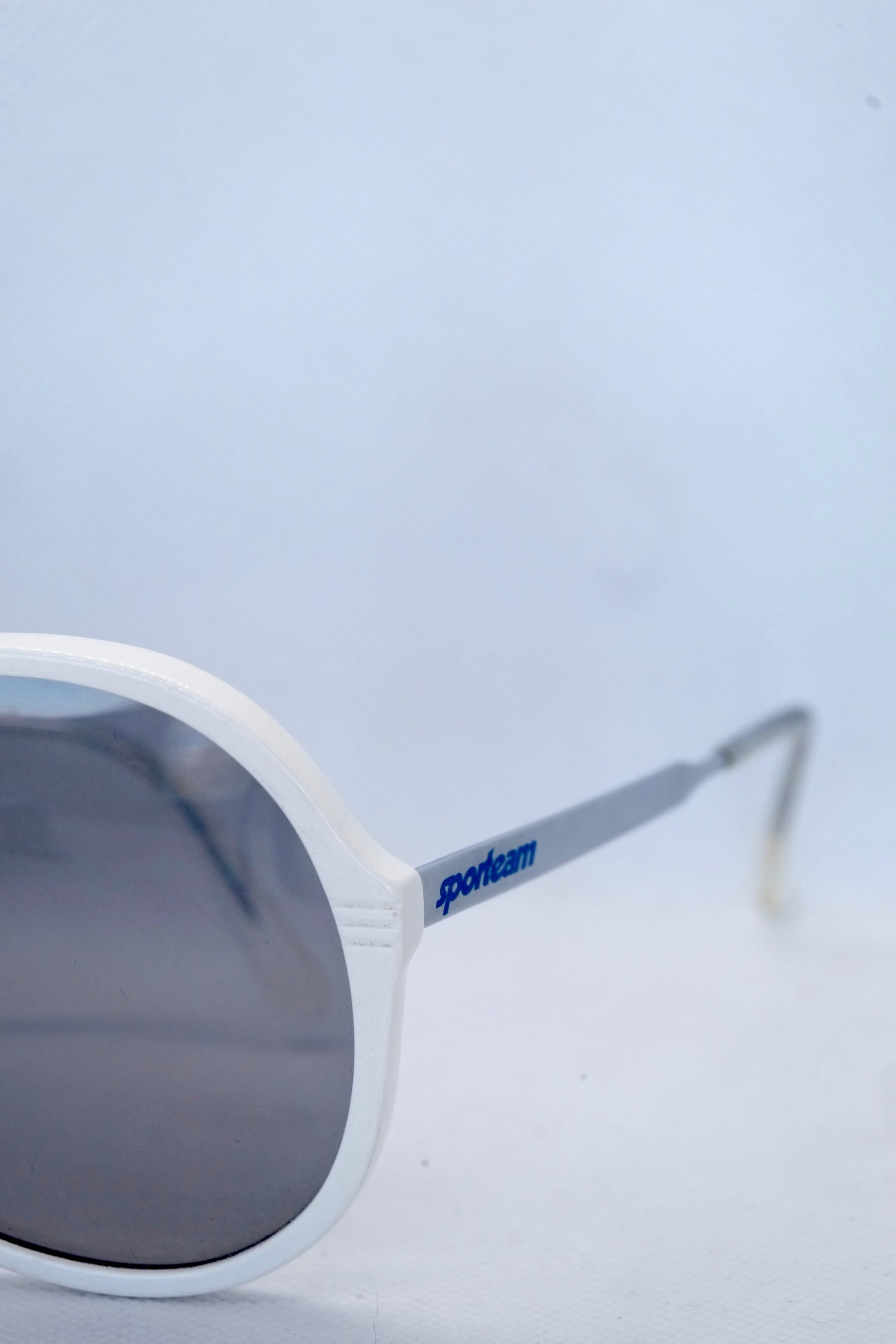 Detail view of white sporteam vintage frames on white background