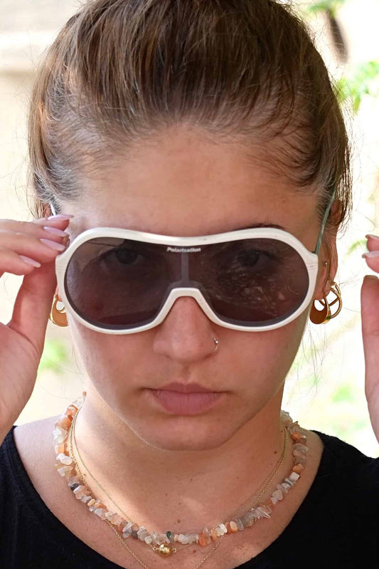 Model wearing white sporteam vintage frames