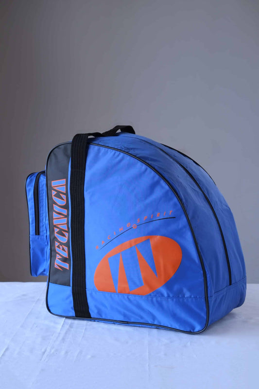 A TECNICA Ski Boots Bag in blue, orange and black photographed on a white background.