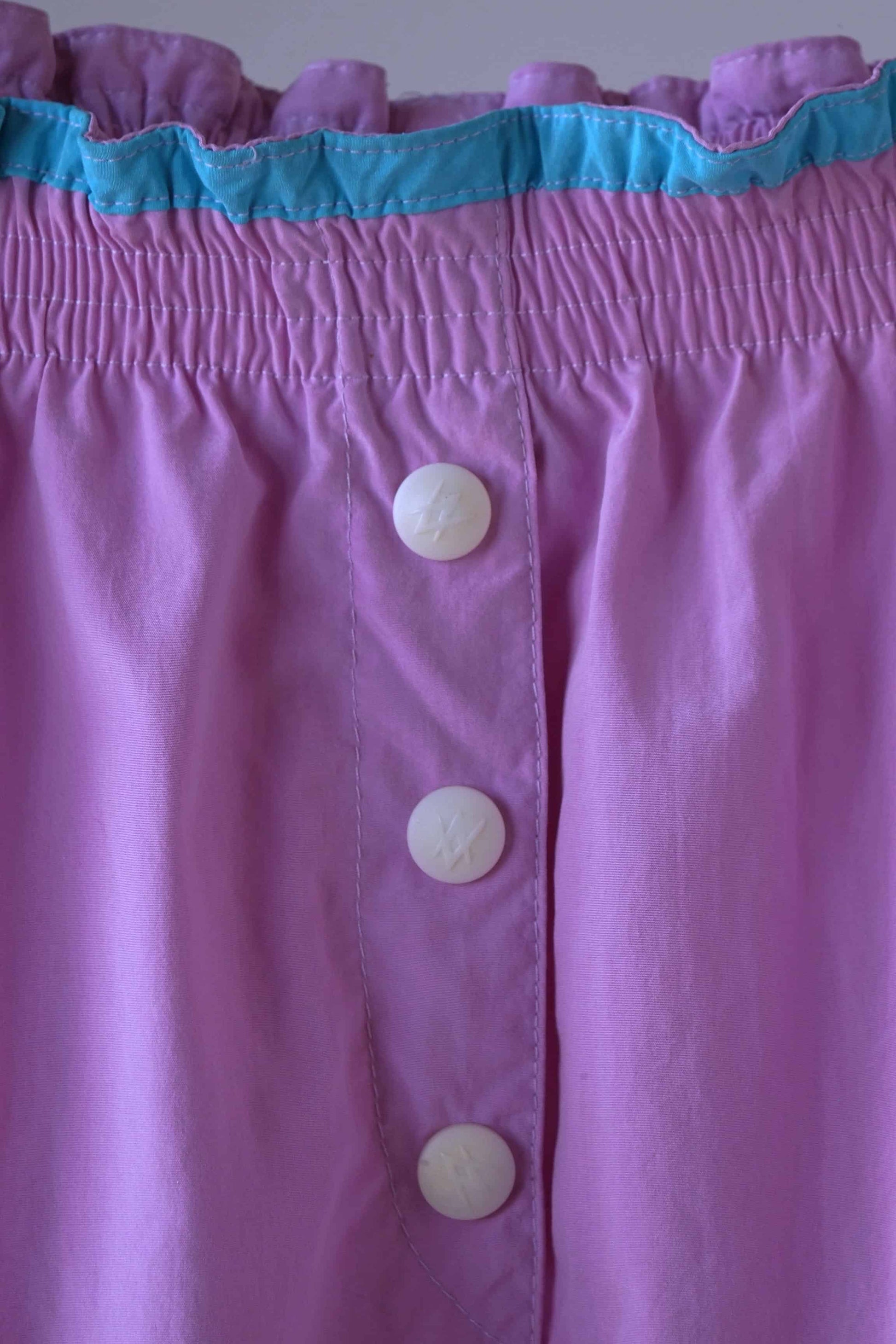 Close up of buttons on VÖLKL Vintage Women's Tennis Shorts