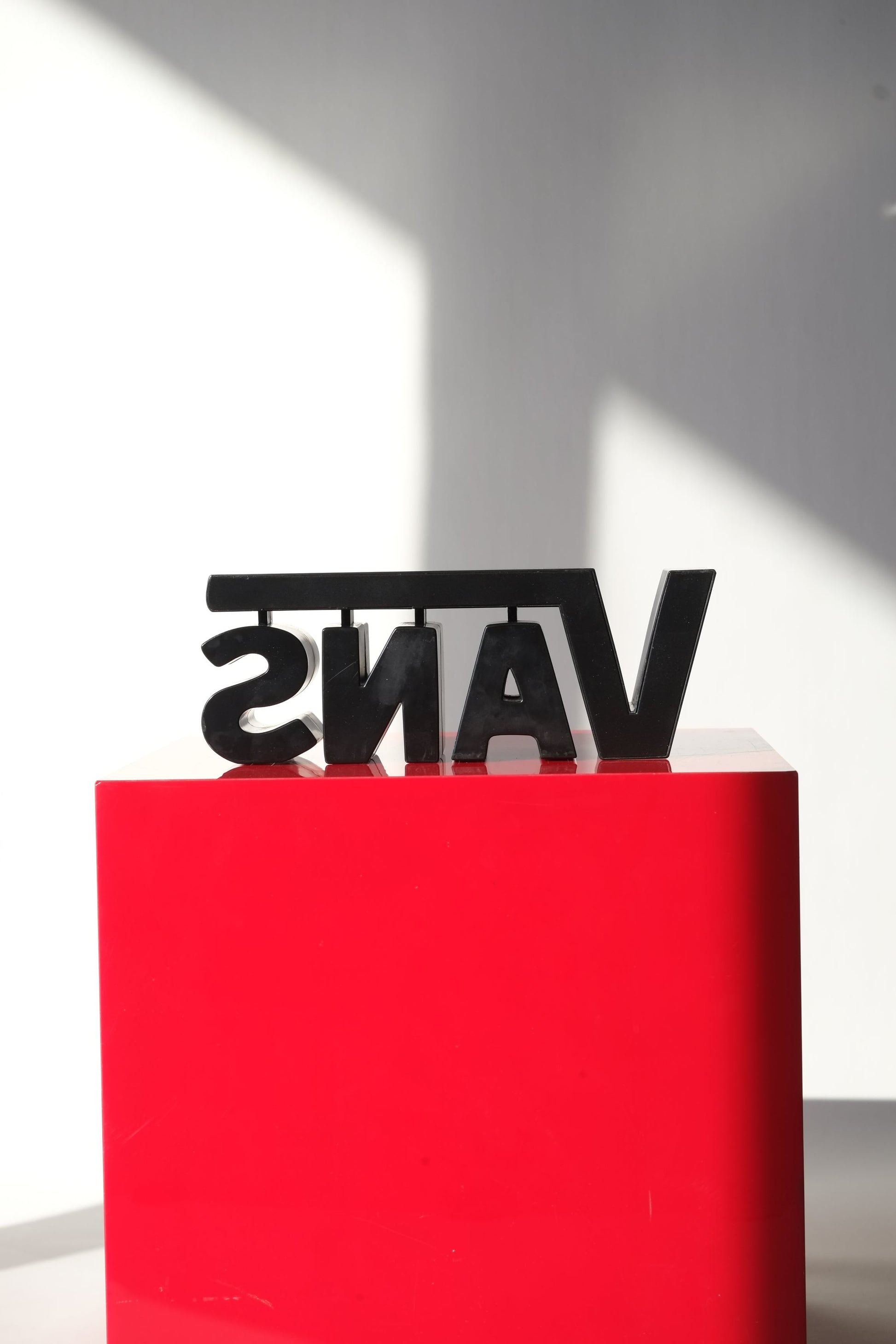 Rear view of the Vans Y2K 3D logo store display sign showing the structure and clean block lettering from behind.