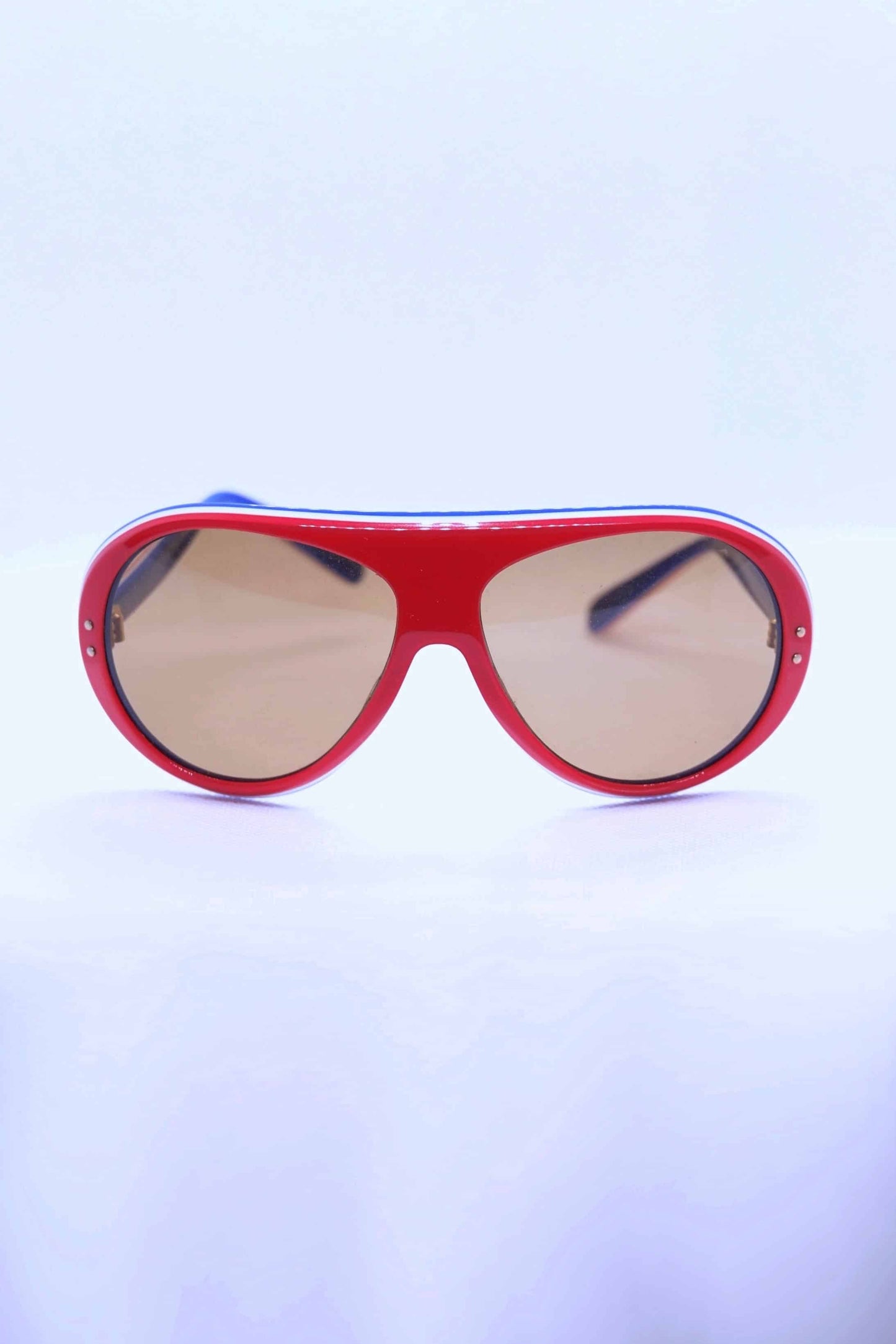 Vintage 70's Rally Coq Sunglasses in red on white background