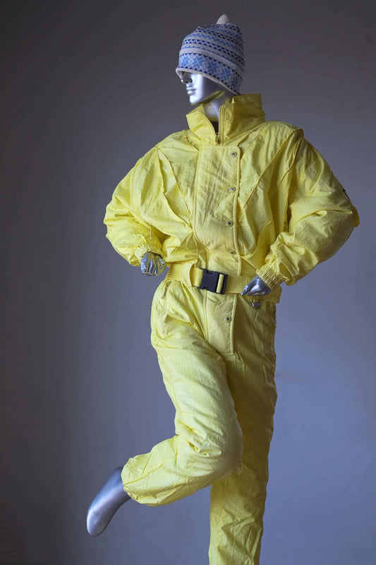 CAMPRI Vintage 90's Ski Suit in yellow displayed on mannequin