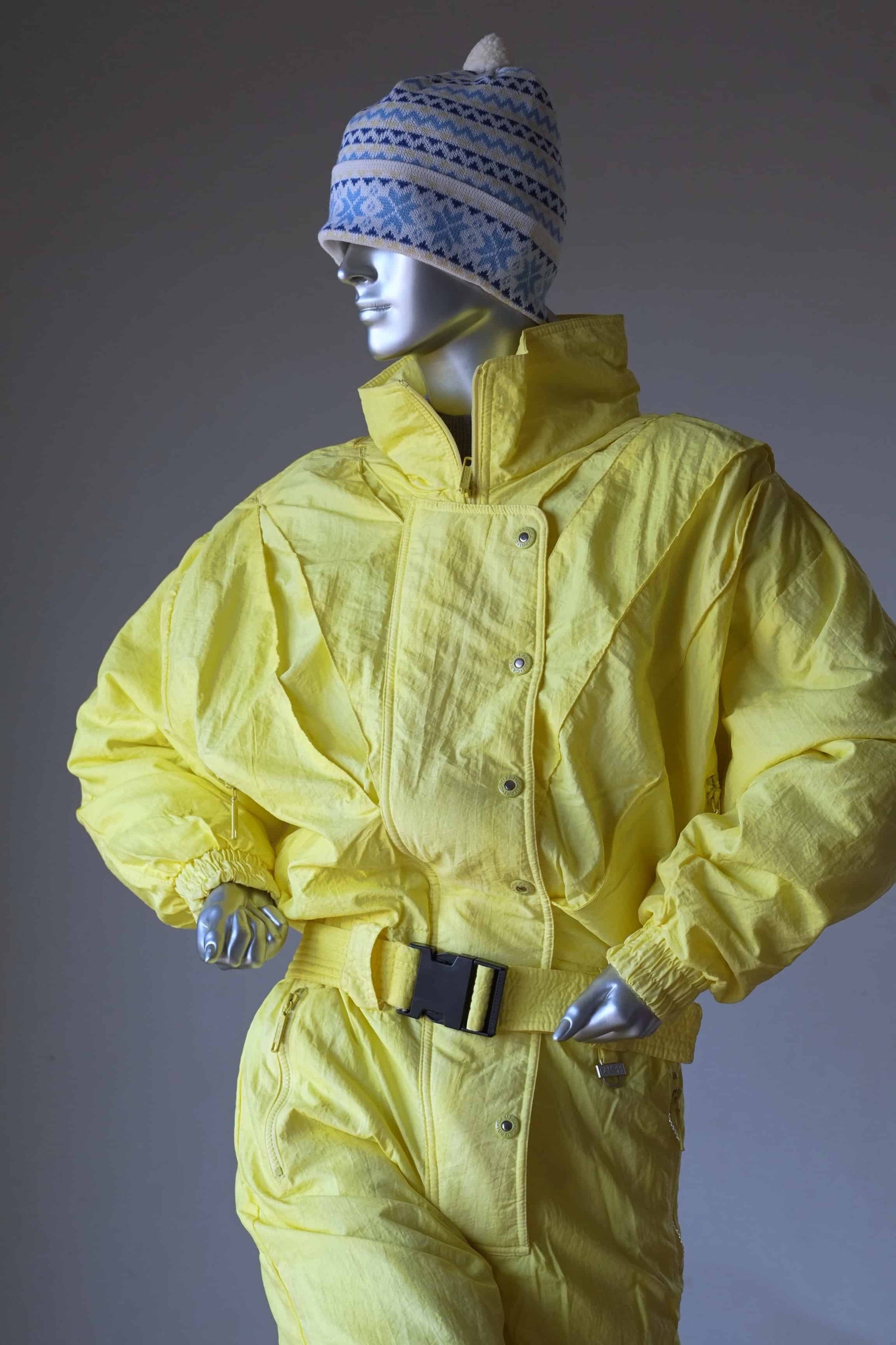 CAMPRI Vintage 90's Ski Suit in yellow displayed on mannequin