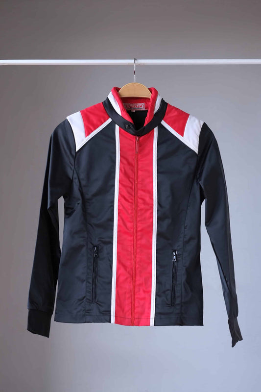 Front view of a vintage Sportalm ski jacket. The jacket is predominantly black with red and white stripes and a stand-up collar.