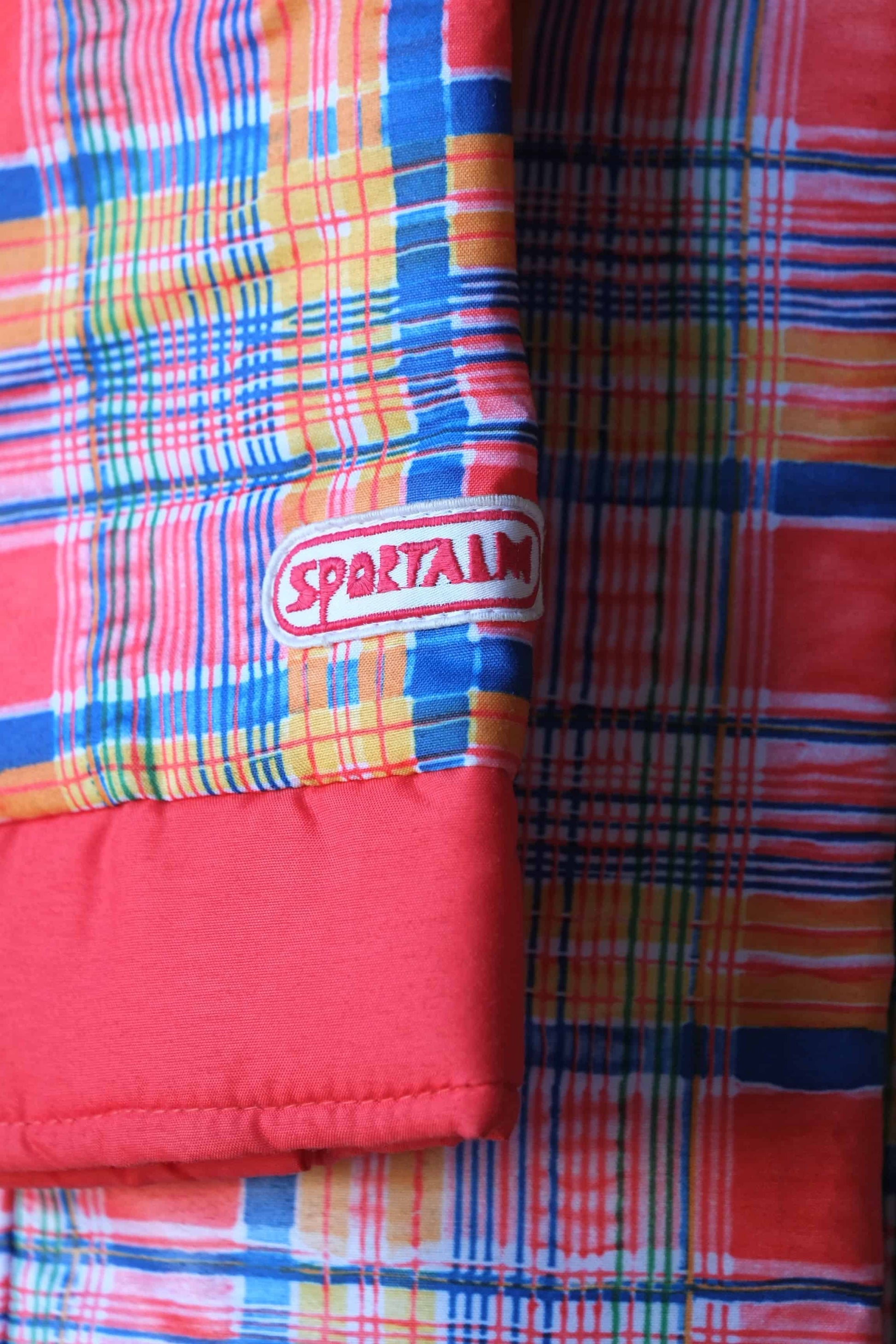 Vintage Women's 70's Three-Piece Ski Suit logo on sleeve