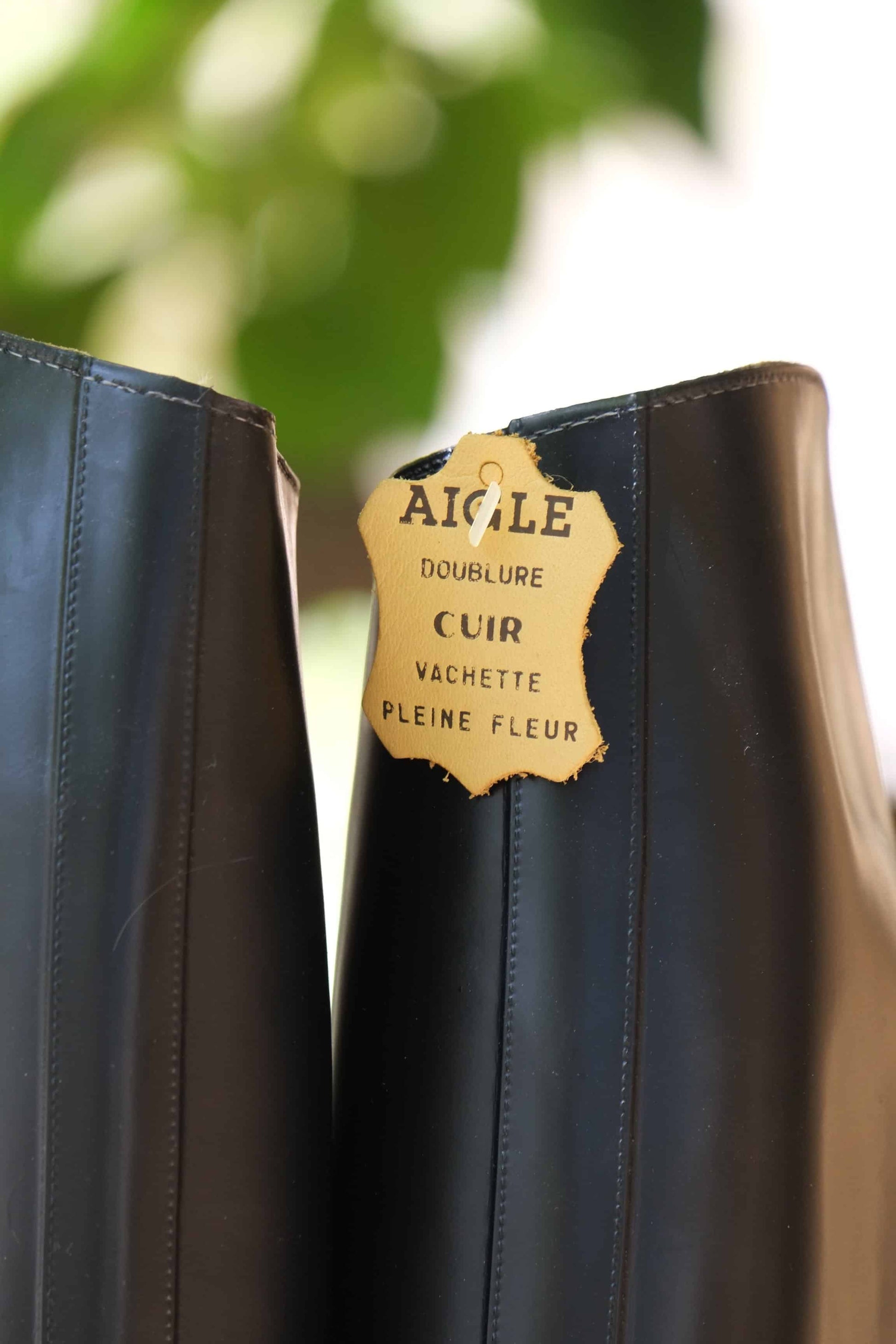 Close shot of the leather tag hanging from the AIGLE Saumur Horseback Riding Boots