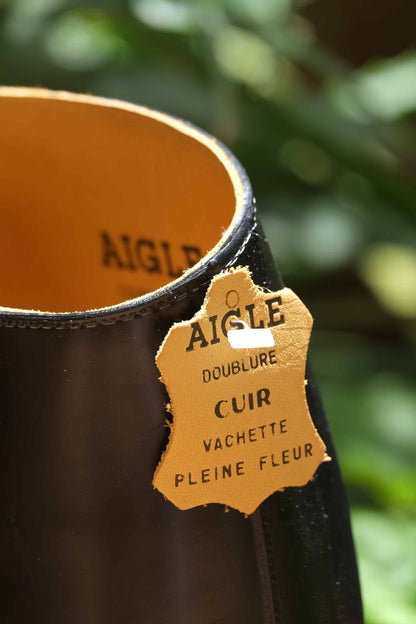 Close shot of the leather tag hanging from the AIGLE Saumur Horseback Riding Boots