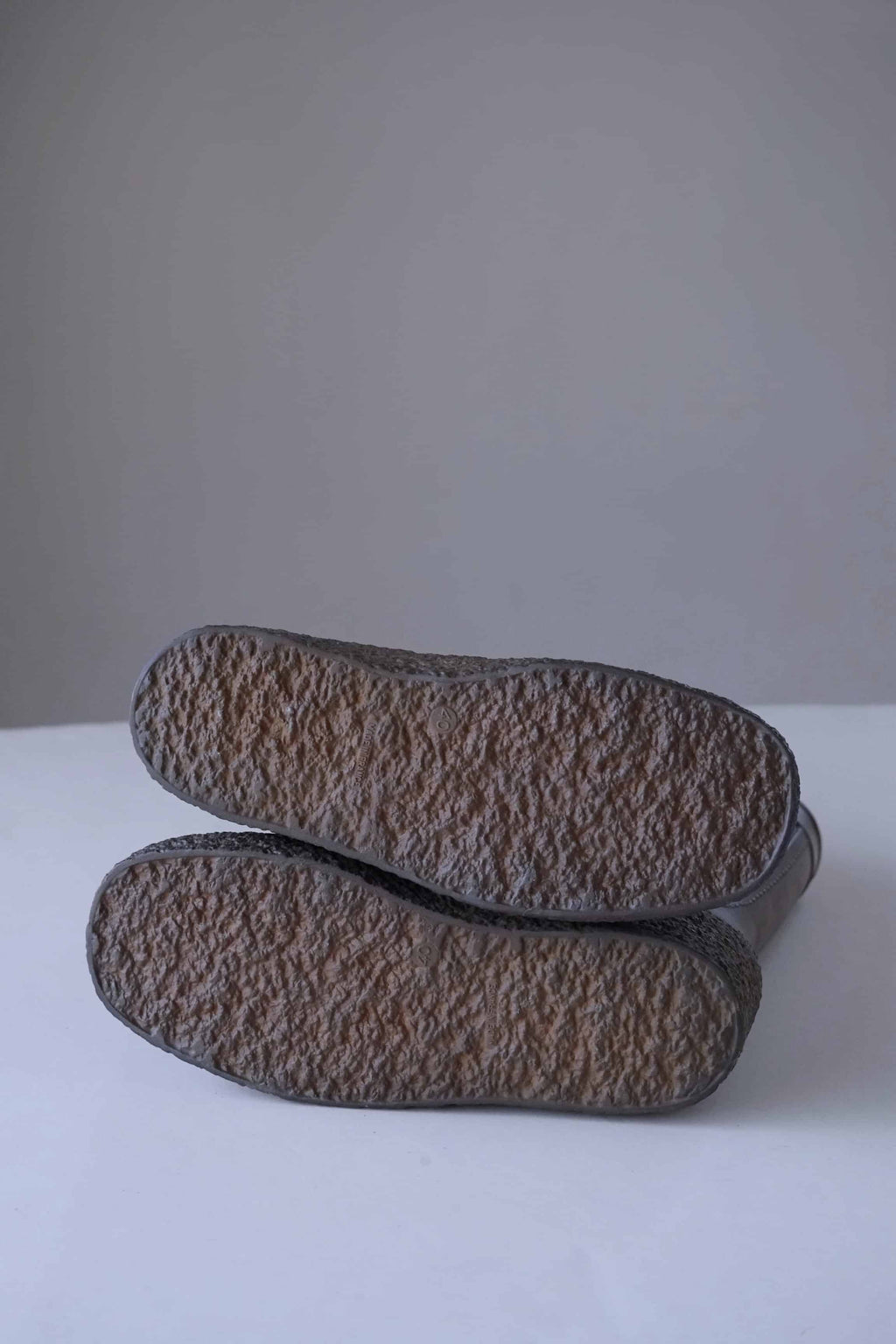Shot of crepe soles of brown vintage rubber Aigle snow boots