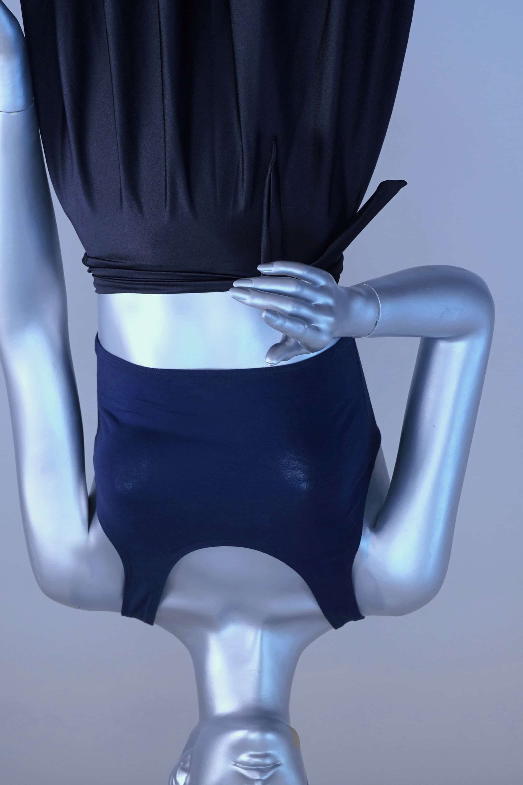 Mannequin wearing a navy crop top against a plain background