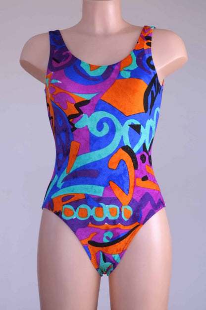 Front view of a colorful vintage Anniel one-piece leotard on a mannequin.