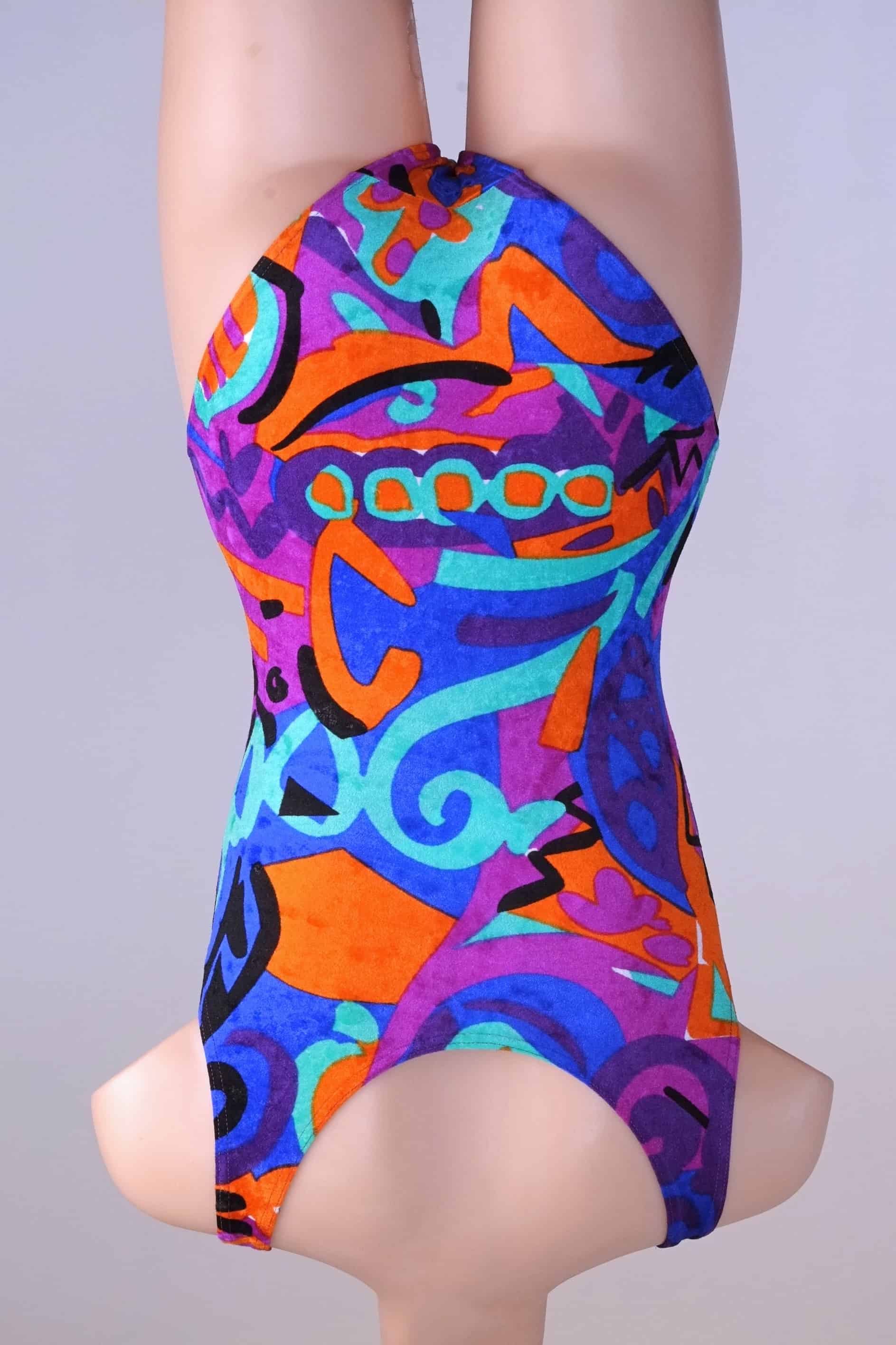 Back view of a colorful vintage Anniel one-piece leotard on a mannequin.