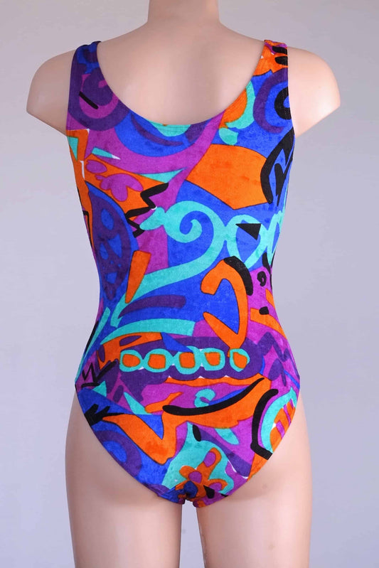 Back view of a colorful vintage Anniel one-piece leotard on a mannequin.