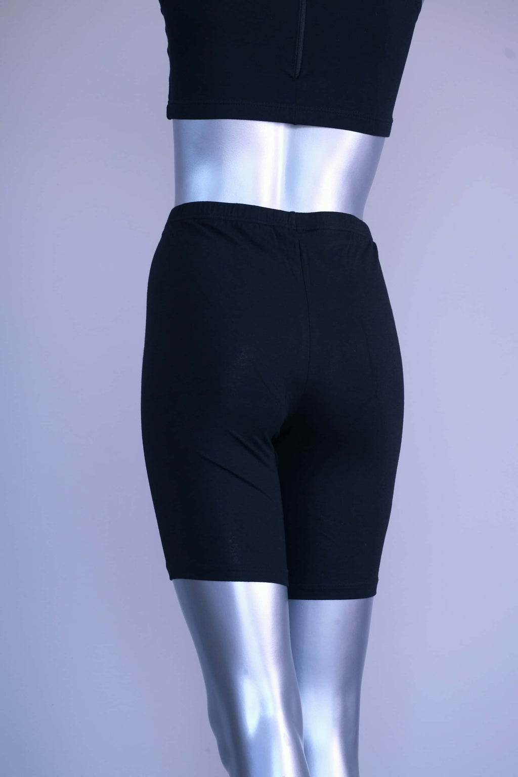Back view of a mannequin wearing black vintage 90s Anniel cotton biker shorts.