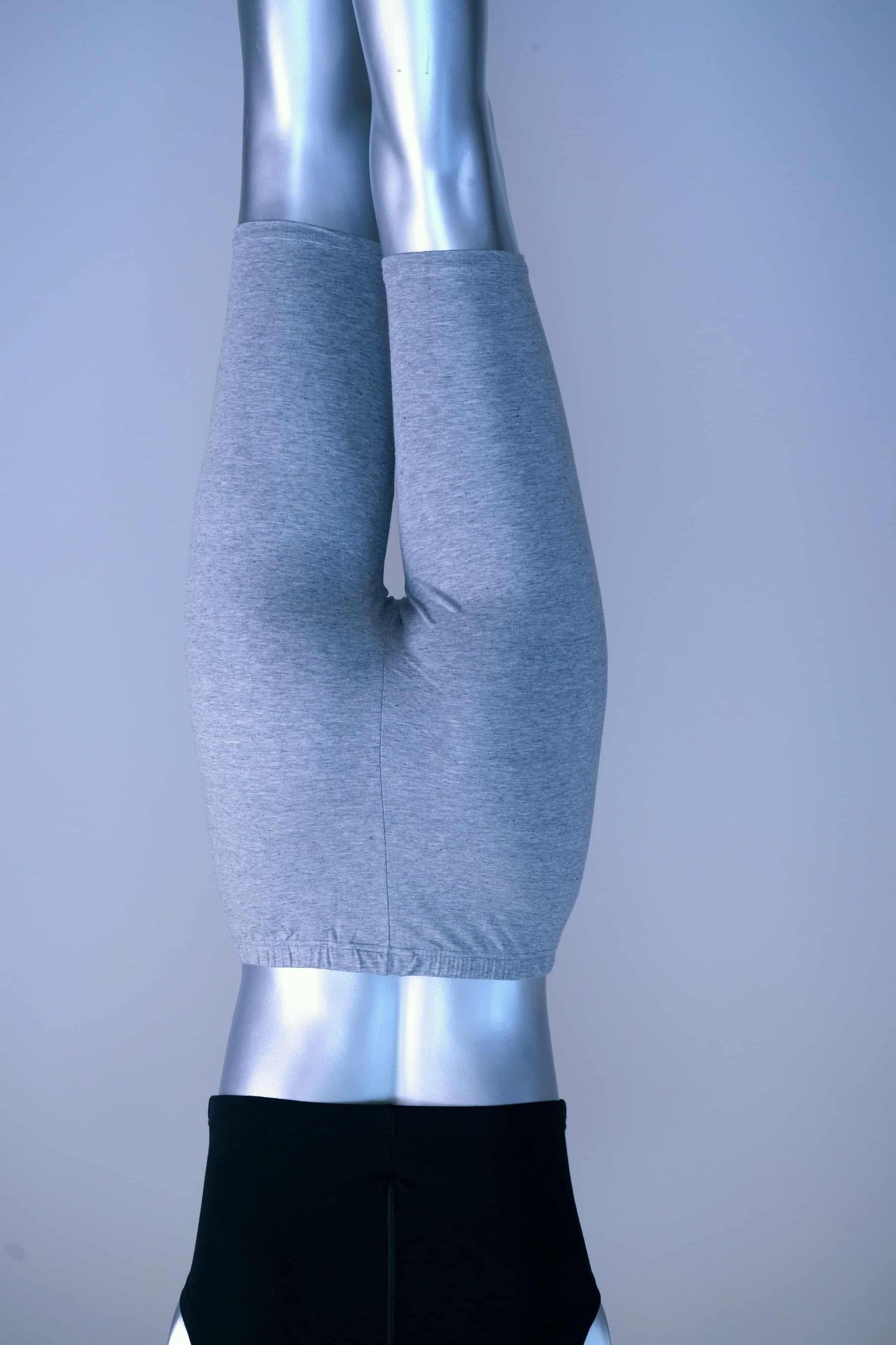 BAck view of vintage above the knee grey biker shorts on a silver mannequin.