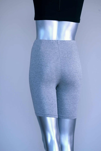 Back view of vintage grey biker shorts on a silver mannequin.