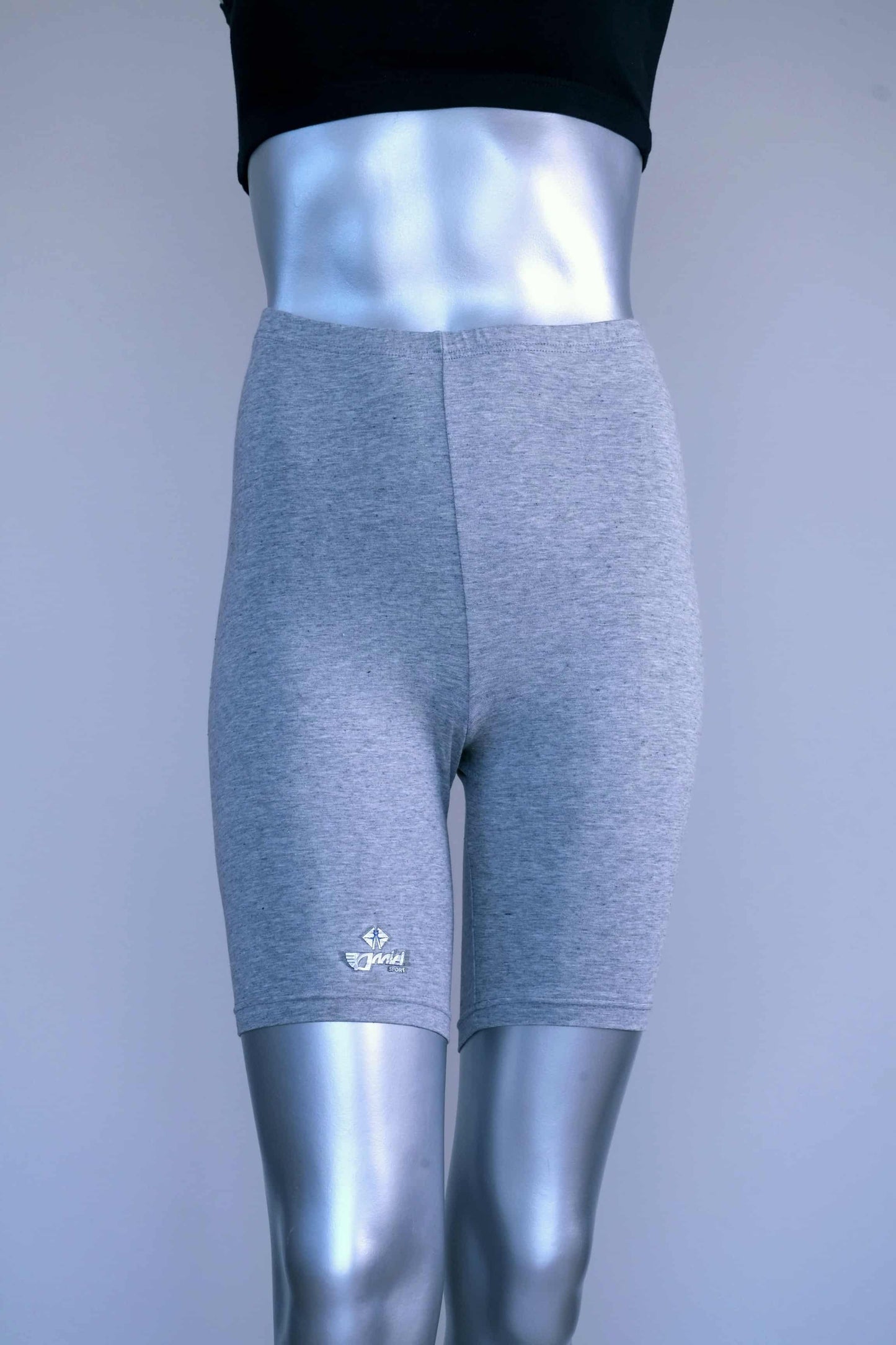 Front view of vintage grey biker shorts on a silver mannequin.
