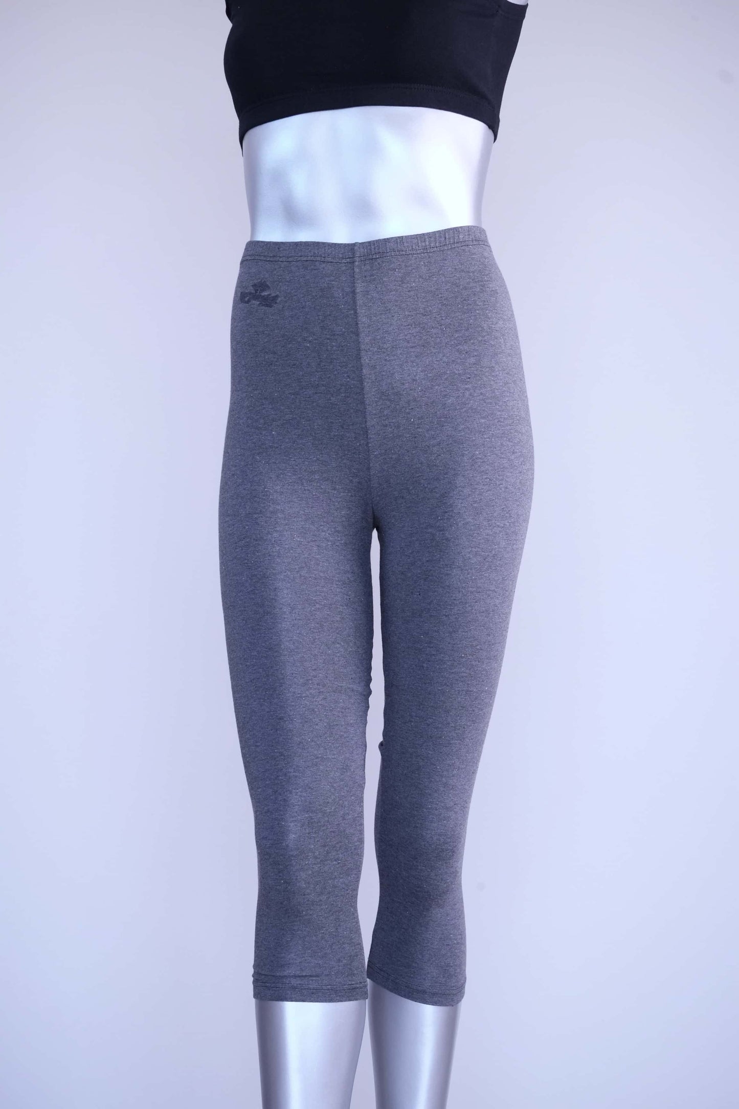 Front view of heather charcoal Anniel vintage capri leggings on a silver mannequin.