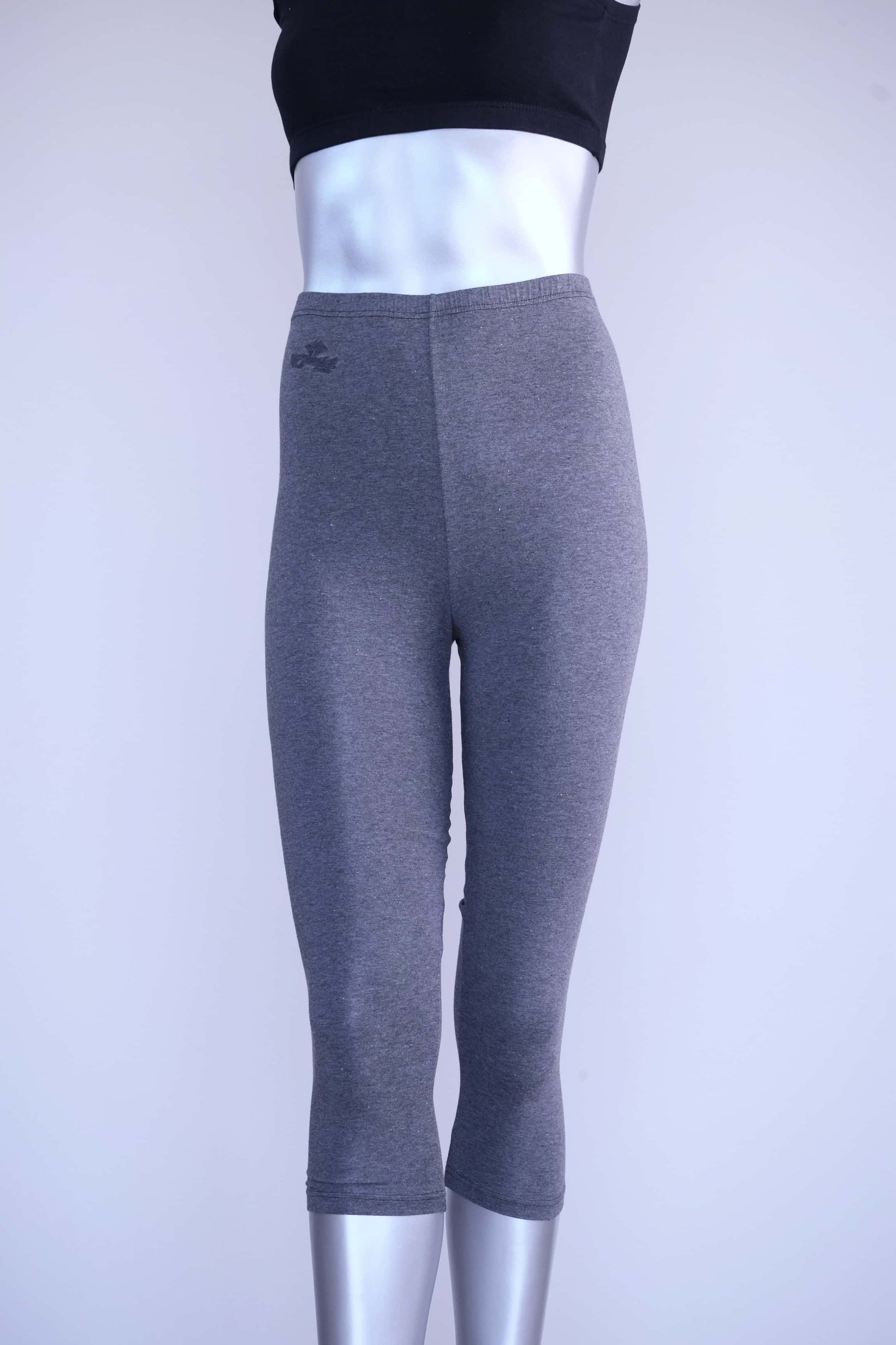 Front view of heather charcoal Anniel vintage capri leggings on a silver mannequin.
