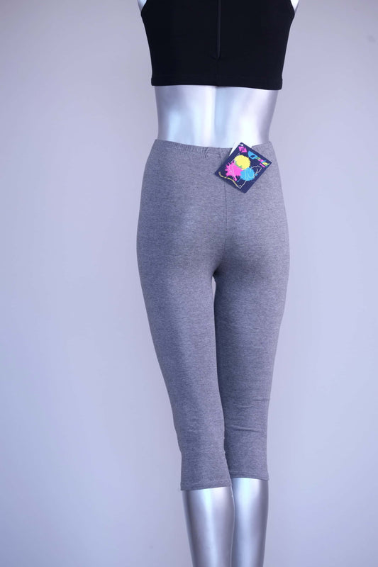 Back view of heather grey Anniel vintage capri leggings on a silver mannequin,  with the original tag attached.