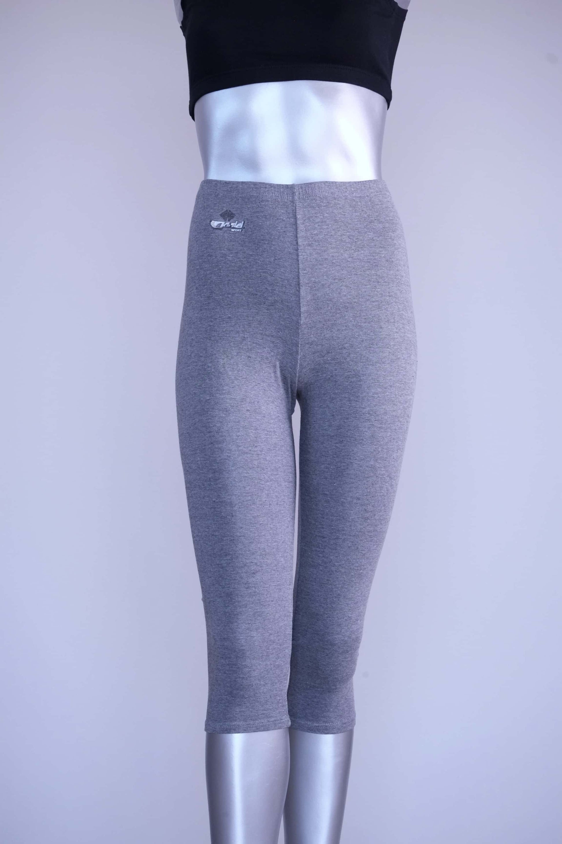 Front view of heather grey Anniel vintage capri leggings on a silver mannequin.