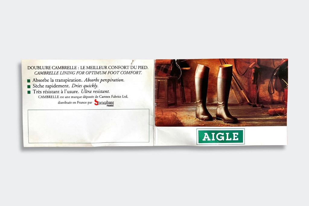 Aigle promotional leaflet highlighting the features of its Cambrelle lining, shown next to a photo of tall rubber riding boots in a rustic stable setting.