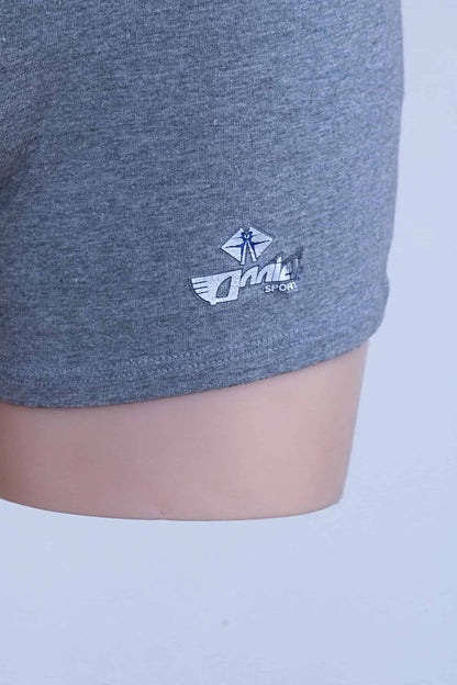 Close-up of worn Anniel Sport logo print on the leg of grey vintage romper.