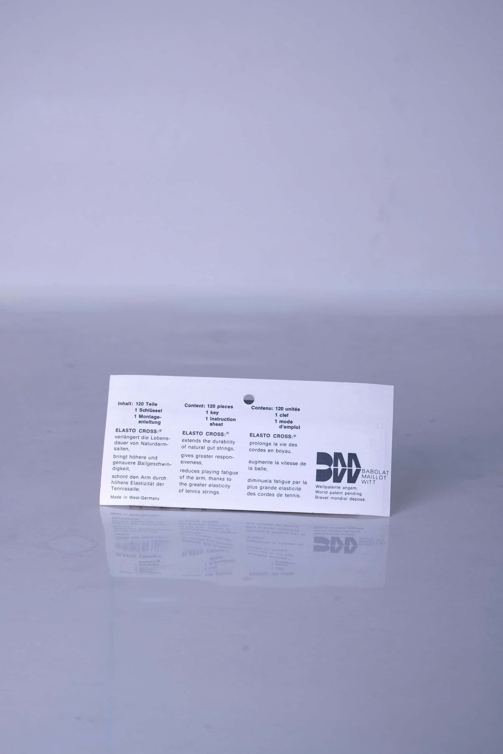 Back view of the vintage Babolat Elastocross packaging, showing the original printed product instructions, technical details, and retro brand layout.