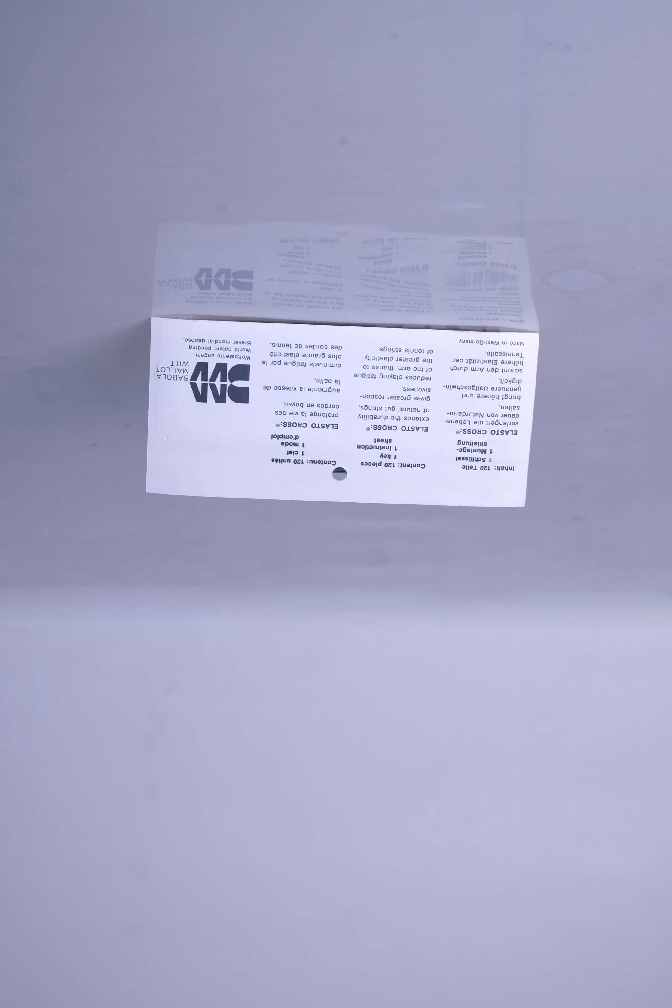 Back view of the vintage Babolat Elastocross packaging, showing the original printed product instructions, technical details, and retro brand layout.
