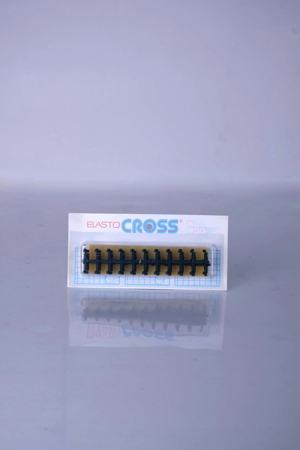 Vintage deadstock Babolat Elastocross tennis string protectors in black, featuring the classic brand typography on the original retail display packaging.