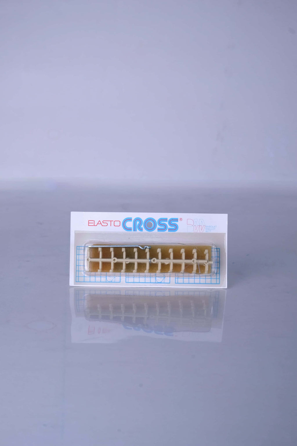 Deadstock vintage Babolat Elastocross tennis string protectors in cream white, shown on its original retail card display packaging.
