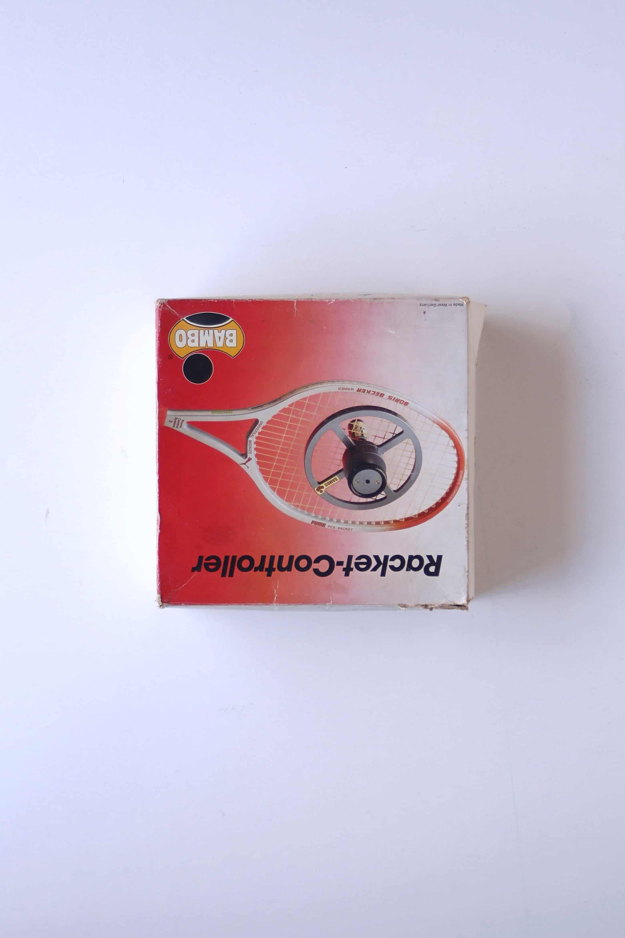 Overhead view of the original red and white retail box for the vintage West German BAMBO Racket-Controller string tension tester.