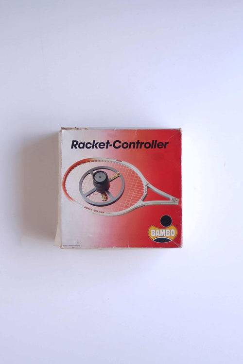 Overhead view of the original red and white retail box for the vintage West German BAMBO Racket-Controller string tension tester.