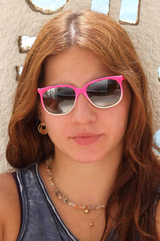 model wearing CÉBÉ pink neon and white Vintage Mirrored Sunglasses