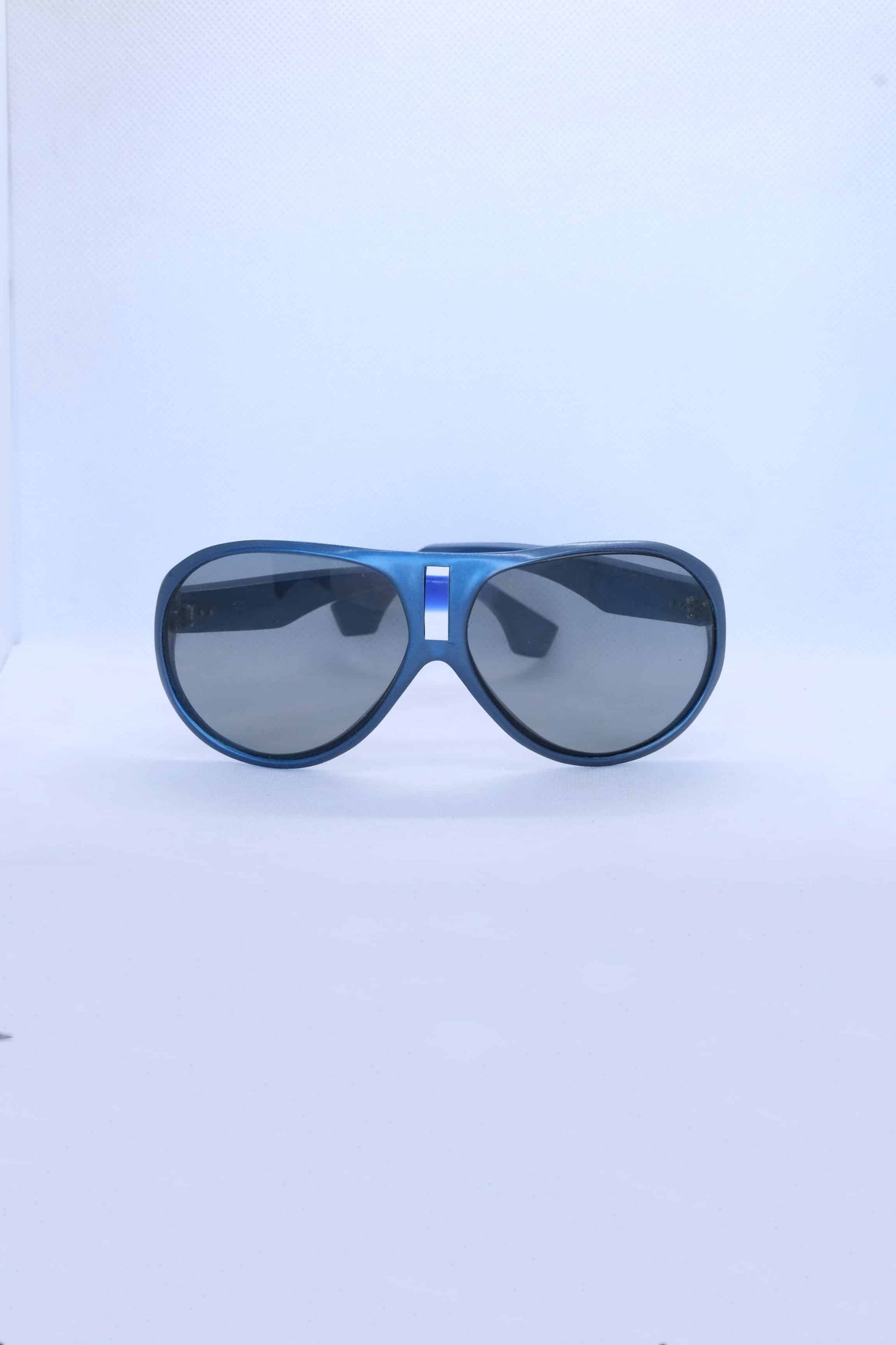 front view of vintage cébé sunglasses metallic blue on white background