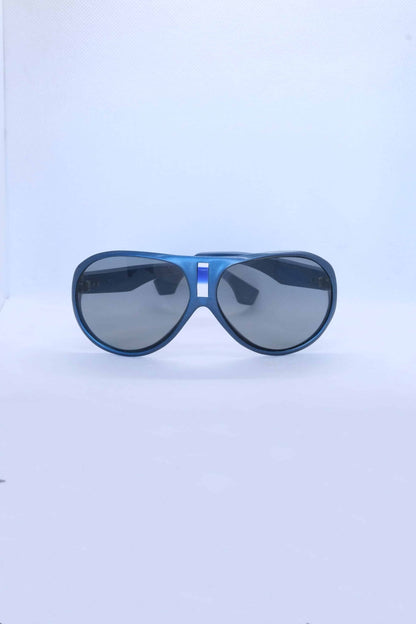 front view of vintage cébé sunglasses metallic blue on white background